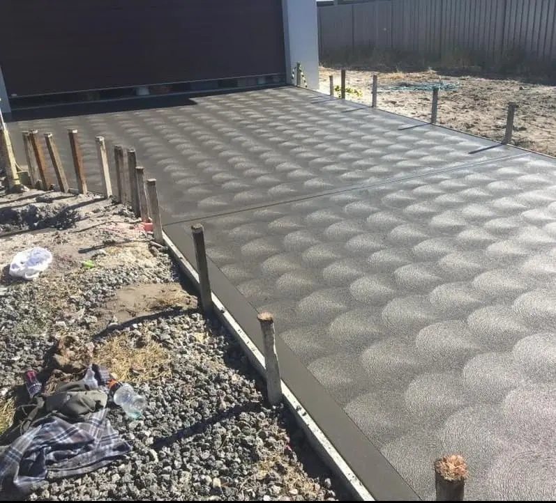 New concrete driveway with a decorative scalloped finish